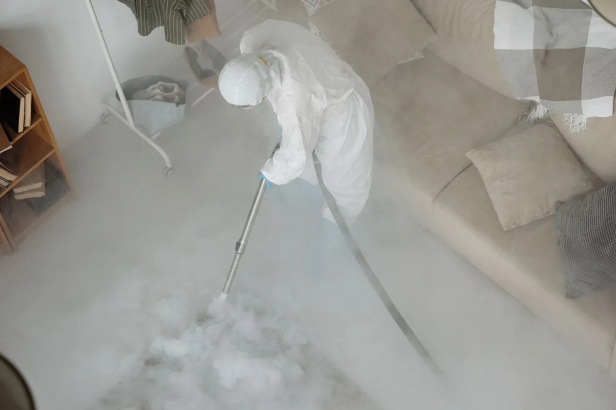 Biohazard cleanup technician in protective equipment, Sage, CA